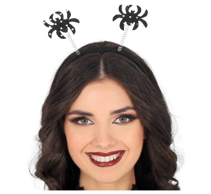 Araña negra de diadema