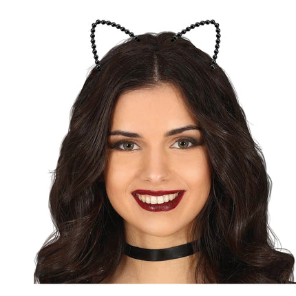 Gato con cinta para el pelo